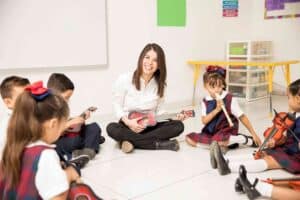 Microteaching, a teacher is teaching to small kids