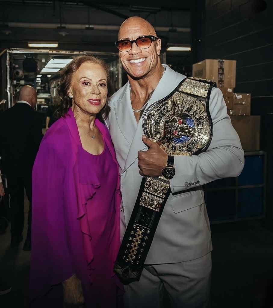 Dwayne Johnson standing with a lady